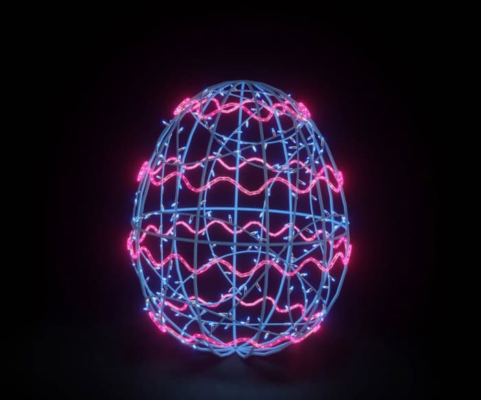 Glowing lit Easter egg on a dark background.